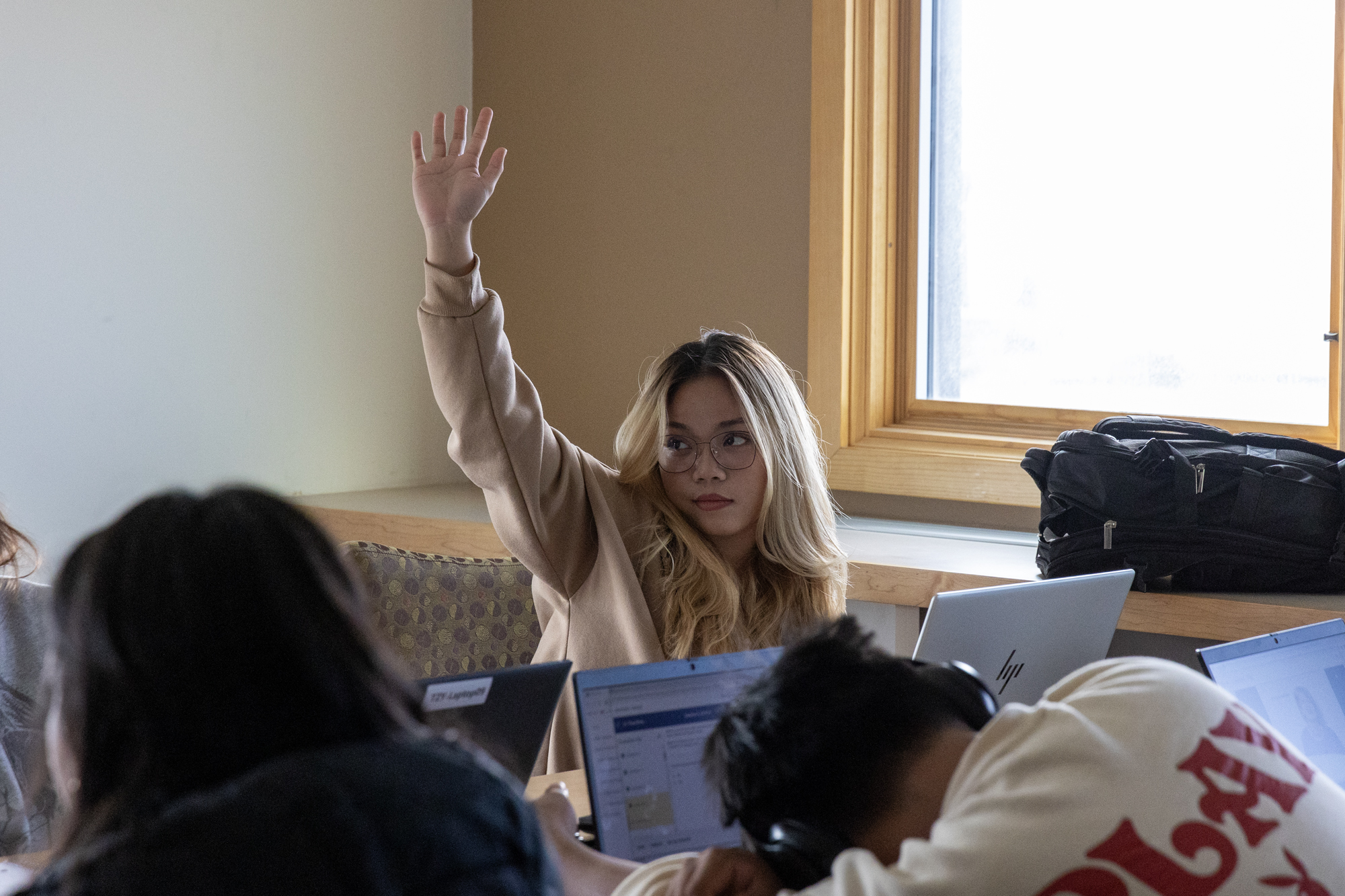 student raising hand